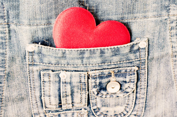 Red heart shape in jeans bag
