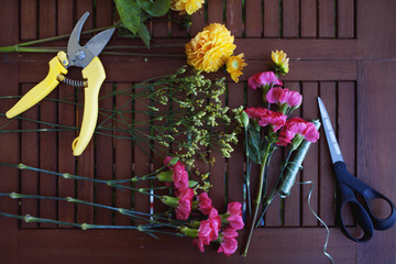 flowers and tools on the table, florist workplace, still life