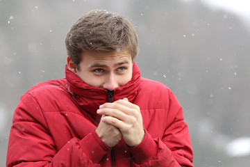 Man shivering in cold winter