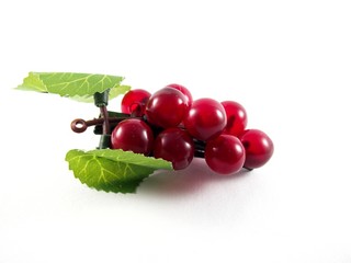 Created plastic grape fruit shape on black hairpin, decorated with artificial leafs, hair accessory, isolated on white background