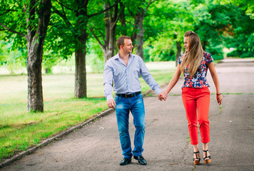 Beautiful loving couple going for a walk outdoors