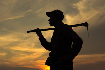 Farmer and sunset