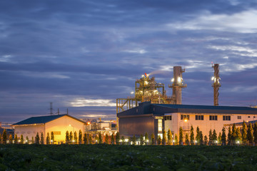 Silhouette of petrochemical plant or Oil and gas refinery in sunrise