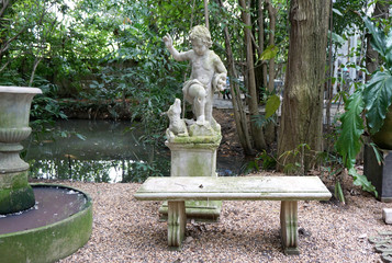 Obraz premium vintage seating with stone sculpture background