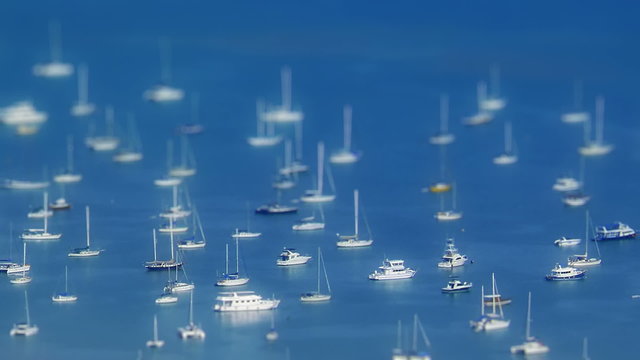 Timelapse harbor view with boats and tide coming. Shot in tilt-shift technique. FullHD 1080p.