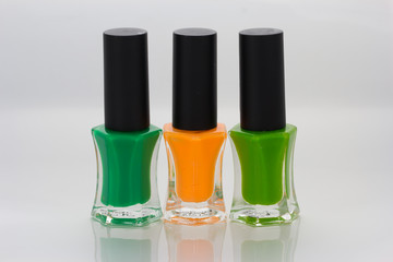 Group of bright nail polishes on white