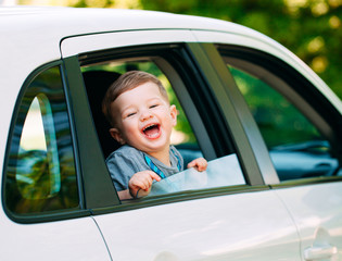 Adorable baby boy in the car