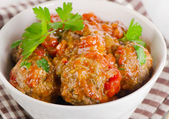 Meatballs with Tomatoes and fresh herbs.