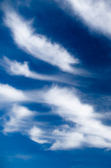 Scenic stratus clouds against deep blue sky