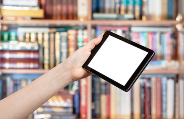 hand holds tablet pc in library