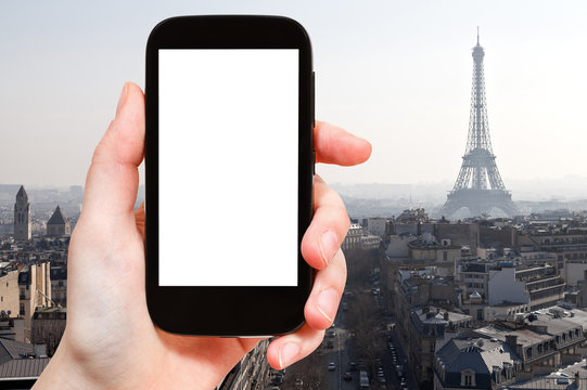 smartphone with cut out screen and Eiffel tower