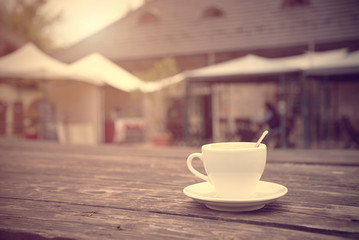 Cup of coffee on a wooden background