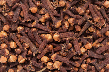 Organic black clove (Syzygium aromaticum) closeup background texture.