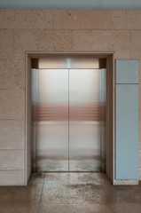 Fototapeta na wymiar Metal lift inside building