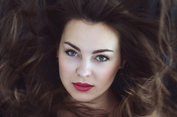 Fototapeta premium portrait of beautiful posh woman with braun hair and red lips