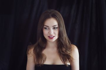 Fototapeta premium portrait of beautiful posh woman with braun hair and red lips