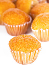 Delicious mini muffins on a white background