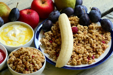 Fruit muesli with yogurt and cereals for breakfast