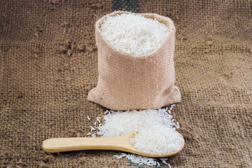  rice with in spoon and pile on sack