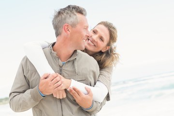 Smiling couple holding one another