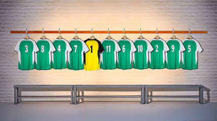 Row of Green and Yellow Football Shirts hanging on Wall in Changing Room with Bench