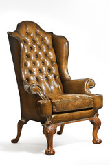 antique leather wing chair carved legs isolated