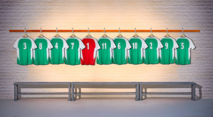 Row of Green and Red Football Shirts hanging on Wall in Changing Room with Bench