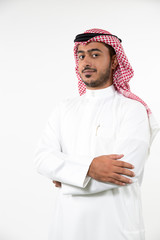 Portrait of Arab man with arms crossed.