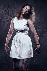 Female zombie with bloody face