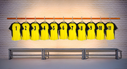 Row of Yellow Football Shirts hanging on Wall in Changing Room with Bench