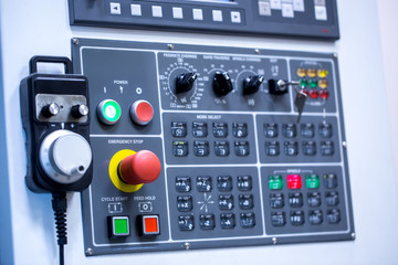 Switches on control panel of production machine