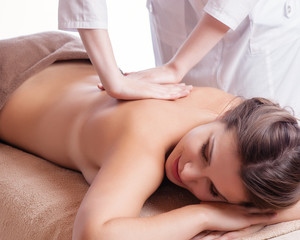 Obraz na płótnie Canvas Masseur doing massage on woman body in the spa salon. Beauty treatment concept.