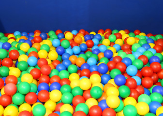 gym in the kindergarten with many colored plastic balls