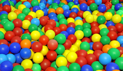 many colored plastic balls in a pool for children