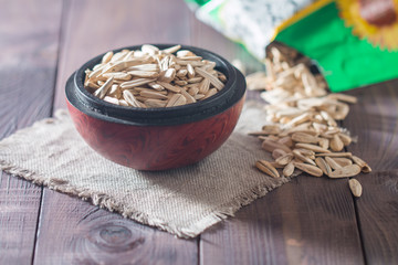 White sunflower seeds in wooden bowl