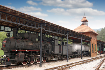 railway station with old steam locomotive