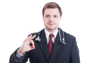 Naklejka premium Elegant medic or doctor showing okay perfect gesture