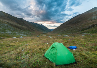 Tourist tent in mountains in the summer