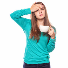 sick woman covered with blanket holding cup of tea