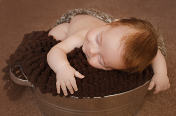 baby boy sleeping and smiling