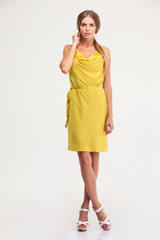 Full length portrait of a charming woman in fashion dress