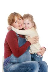 Fototapeta na wymiar daughter hugging pregnant mom