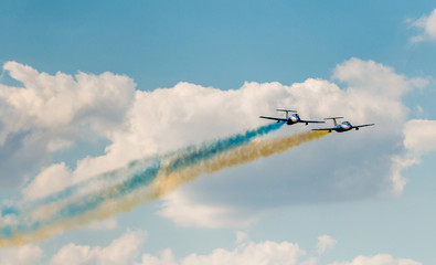 airplanes in the sky with colorful smoke of ukrainian flag 