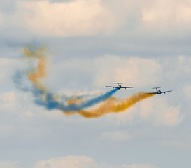 airplanes in the sky with colorful smoke of ukrainian flag 