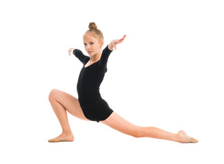 little gymnast stretching on the floor