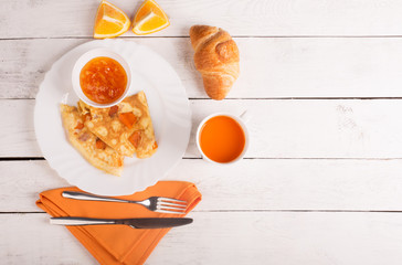 Omelette with pumpkin, carrot juice and croissant