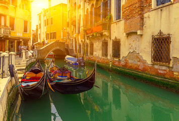 Fototapeta na wymiar Canal with gondolas in Venice, Italy