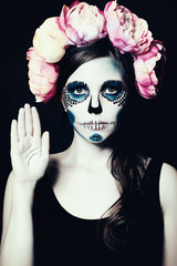 Woman with Halloween Makeup.  Sugar skull Beautiful Model