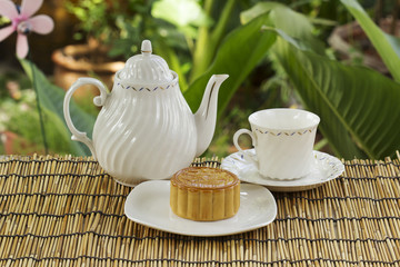 Moon cake with golden lotus seed and cup of Tea