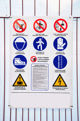 Board with different signs for accident prevention. Italy.